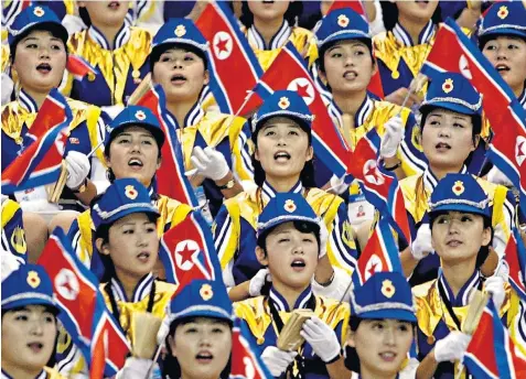  ??  ?? Cheerleade­rs, above, for North Korea’s ‘squads of beauty’ are reportedly hand-picked based on their beauty and their loyalty to the Pyongyang regime