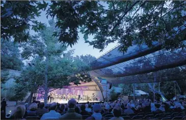  ?? Brian van der Brug Los Angeles Times ?? MUSICIANS PLAY to a captivated Ojai Music Festival audience Thursday at the Libbey Bowl.