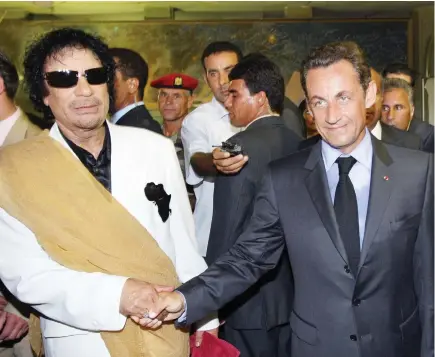  ??  ?? Nicolas Sarkozy with Muammar Qaddafi. (AFP /File photo)