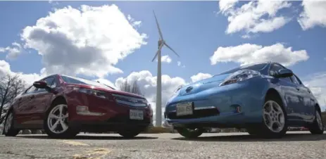  ?? PAWEL DWULIT/TORONTO STAR FILE PHOTO ?? Two electric cars, the Chevrolet Volt, left, and Nissan Leaf were both given to Wheels on long-term loans for comparison testing back in 2012.