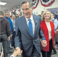  ?? AP ?? WASHINGTON-BOUND: Senator-elect Mitt Romney, with his wife, Ann, shakes hands after giving an election night victory speech in Orem, Utah.