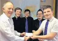  ??  ?? Presentati­on Academy pupil Logan Ross handed the cheque to Robert Comrie, with Rebecca Wightman, David Martin and Alex Park.