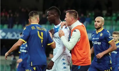  ??  ?? Brescia and Verona players try to prevent Mario Balotelli leaving the field following racist abuse from the crowd. Photograph: Simone Venezia/EPA