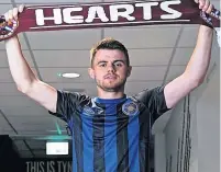  ?? ?? STRIP SHOW Forrest in Hearts kit after signing two-year deal