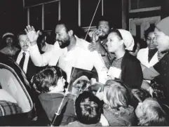  ??  ?? Gaye is mobbed by admirers as he leaves west London’s Mangrove Cafe in 1976 (Getty)