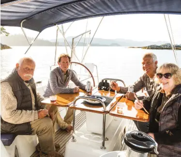  ??  ?? Donald, Burke, Tor and Christine enjoy a sunny evening and salmon sashimi in the cockpit. Shi-shi Beach, just across the Strait of Juan de Fuca from Vancouver Island, is a wild place to stop (opposite).