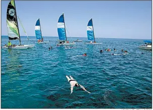  ?? AP/ISMAEL FRANCISCO ?? Tourists get in some snorkeling recently off a beach in Varadero, Cuba. The Cuban government has set a goal of drawing 5 million visitors this year.