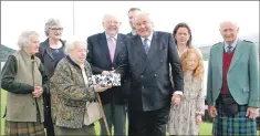  ??  ?? Sir Jamie McGrigor receives a retirement gift from the constituen­cy associatio­n. Left to right are: Mary McGrigor, Jamie’s mother; his sister Kirsty; Valerie Cox of Kilmartin; Sandy MacPherson; Douglas Pattullo; Sir Jamie; Jamie’s wife Emma; daughter,...