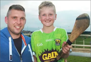  ??  ?? Fran O’ Gorman with his son, Rhys, at the G.A.A. supporters’ race night on Thursday.
