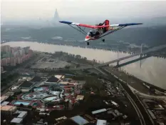  ?? —AP ?? An ultralight aircraft flies over the city of Pyongyang in North Korea.