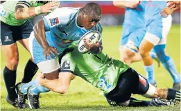  ?? Picture: AFP/ PHILL MAGAKOE ?? TUMBLING DOWN: Bulls prop Trevor Nyakane is brought down by Highlander­s’ lock Alex Ainley at Loftus Versfeld Stadium in a Super Rugby match