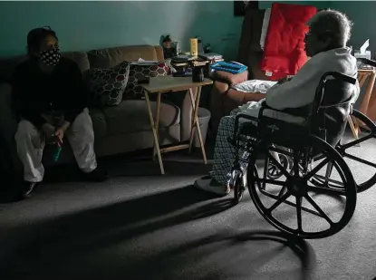  ?? Photos by Lisa Krantz / Staff photograph­er ?? Maria Rodriguez, 79, left, talks with Herminia Rodriguez, 85, (no relation) in Herminia’s apartment at the Ernest C. Olivares Senior Community Residence during a long electricit­y outage in San Antonio last Wednesday.