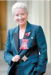  ?? AP-Yonhap ?? Emma Thompson stands outside Buckingham Palace, London, after being made a Dame Commander of the British Empire by Prince William, Wednesday.