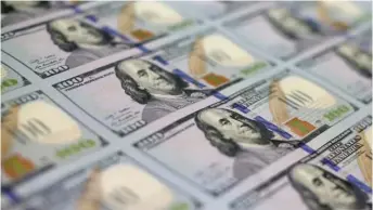  ?? MARK WILSON/GETTY IMAGES ?? Stacks of $100 bills at the Bureau of Engraving and Printing in Washington, D.C.