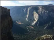  ?? AP FILE PHOTO BY AMANDA LEE MYERS ?? In this Sept. 27, photo a wedding couple are seen being photograph­ed at Taft Point in California’s Yosemite National Park.