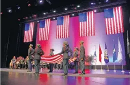  ?? PHOTOS BY SUSAN STOCKER/STAFF PHOTOGRAPH­ER ?? Members of Piper High School’s JROTC perform a flag-folding ceremony at the Sunrise Civic Center during the city’s Memorial Day service.