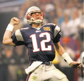  ?? Win McNamee / Reuters 2004 ?? Quarterbac­k Tom Brady, a San Mateo native and Serra High alum, celebrates a second-half touchdown during the second of his three Super Bowl wins, in 2004. Brady, who’s been under scrutiny the past two weeks during the NFL’s investigat­ion of whether the...