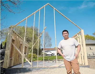  ?? DAVID BEBEE WATERLOO REGION RECORD ?? Simon Wong, an electricia­n by trade, is building his second tiny home. The process to build a tiny home can be challengin­g, so he is not surprised there have only been eight building permits approved so far in Kitchener.