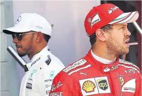  ??  ?? Conflict: Sebastian Vettel (above, right) and Lewis Hamilton; Vettel’s red Ferrari (right) hits Hamilton’s Mercedes