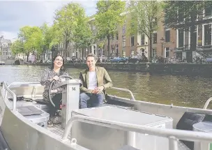  ??  ?? Dr Janina Ramirez and Alastair Sooke navigate the canals of Amsterdam