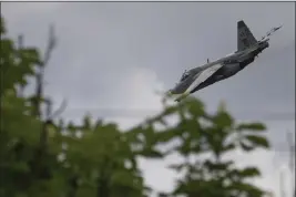  ?? EVGENIY MALOLETKA — THE ASSOCIATED PRESS ?? A Ukrainian Su-25jet flies after an attack on Russian positions in Donetsk region, Ukraine, Tuesday.