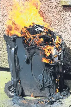  ?? Picture: Dougie Nicolson. ?? Many thieves who steal wheelie bins are also setting them alight, creating dangerous situations.