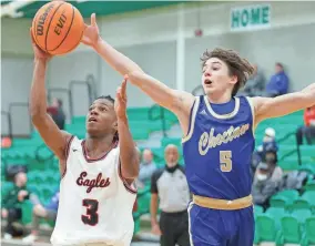  ?? Del City's Dkalin Godwin drives past Choctaw's Camden Hyman in a McGuinness Classic game on Thursday in Oklahoma City. BRYAN TERRY/THE OKLAHOMAN ??