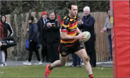  ??  ?? Mark Butler heads for the try-line.