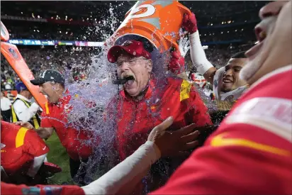  ?? MATT SLOCUM — THE ASSOCIATED PRESS ?? Kansas City Chiefs head coach Andy Reid is dunked after their win against the Philadelph­ia Eagles at Super Bowl 57on Sunday, in Glendale, Ariz.