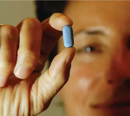  ??  ?? Truvada, already used to treat people with HIV, also helps prevent the virus from infecting healthy people. The Food and Drug Administra­tion is expected to decide by June 15 whether the pill’s maker should be allowed to formally market the drug for...