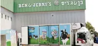  ?? (Ronen Zvulun/Reuters) ?? A BEN & JERRY’S delivery truck is loaded at their factory in Be’er Tuviya yesterday.