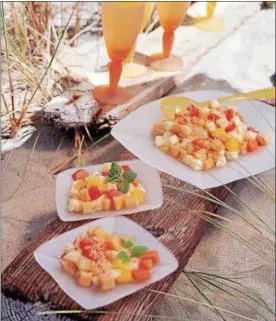  ?? CHRIS SHORTEN — TRIBUNE CONTENT AGENCY ?? Tropical Fruit Salad With Toasted Coconut