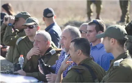  ?? (Ariel Hermoni/Defense Ministry) ?? DEFENSE MINISTER Avigdor Liberman looks out on the northern border last month.