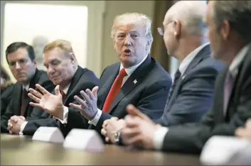  ??  ?? President Donald Trump speaks during a meeting with steel and aluminum executives Thursday in the White House. From left, Roger Newport of AK Steel, John Ferriola of Nucor, Mr. Trump, Dave Burritt of U.S. Steel and Tim Timkin of Timken Steel.