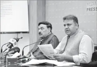  ?? ?? ISLAMABAD
Federal Minister for Informatio­n and Broadcasti­ng, Chaudhry Fawad Hussain and Federal Minister for Interior, Sheikh Rasheed Ahmad addressing a press conference. -APP