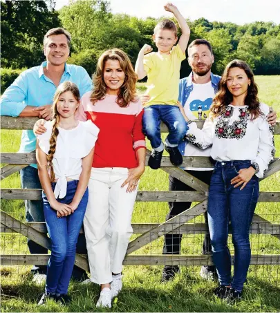  ?? ?? Safe: The Kmit family with Natasha Kaplinsky and, far left, her husband Justin