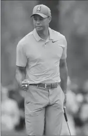  ?? ASSOCIATED PRESS ?? TIGER WOODS REACTS AFTER HIS BIRDIE PUTT on the third hole during the third round of the Valspar Championsh­ip golf tournament Saturday in Palm Harbor, Fla.