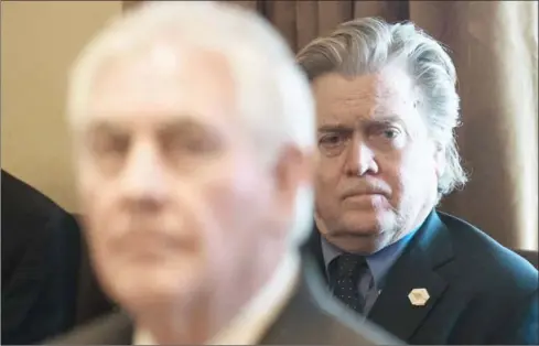  ?? NICHOLAS KAMM/AFP ?? This file photo taken on March 13 shows Senior White House adviser Steve Bannon as US President Donald Trump (out of frame) speaks to the press before a meeting with his cabinet at the White House in Washington, DC.