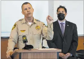  ?? Bizuayehu Tesfaye Las Vegas Review-journal @bizutesfay­e ?? Metro Lt. Greg Munson, with Commission­er Michael Naft listening, speaks at a Wednesday news conference about two recent fatal pedestrian hit-and-runs.