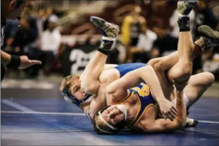  ?? NATE HECKENBERG­ER - FOR MEDIANEWS GROUP ?? Zach Needles of Spring-Ford spladles Canon McMillan’s Logan Mizenko on his way to a technical fall at 145 pounds.