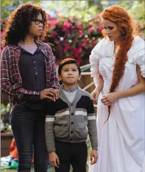  ??  ?? Storm Reid as Meg Murry, Deric McCabe as Charles Wallace Murry and Reese Witherspoo­n as Mrs Whatsit in AWrinkleIn­Time.