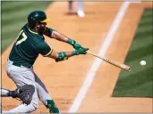  ?? ROB TRINGALI — GETTY IMAGES ?? The A’s Elvis Andrus bats during a spring training game against the Rockies on Wednesday at Salt River Field in Scottsdale, Arizona.