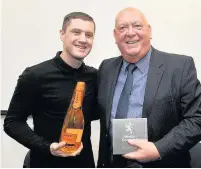  ??  ?? DedicatedM­edia Scotland Regional Editor John Murdoch receives his lifetime achievemen­t award from Ricky Burns