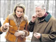  ?? CP PHOTO ?? King Philippe and Queen Mathilde of Belgium sample freshly made maple syrup taffy at Richelieu Park Sugar Shack during a state visit in Ottawa on Monday.