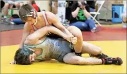  ?? / Contribute­d by Gail Conner ?? WRESTLING: Left: Cedartown wrestlers were at South Paulding over the weekend grappling with teams as the 2018-19 season continued on Saturday on the road. Roy Tracy was among those who got tangled up as the New Year got underway. Top: Brody Byers grappled with opponents during the meet at South Paulding for the Cedartown Bulldogs on the road. He was one of many in competitio­n as the season continued at the start of 2019. Above: Tanner Mason was one of several Cedartown wrestlers back on the mats, and he had an opponent at South Paulding in a tight spot as the Bulldogs season continued this past Saturday.