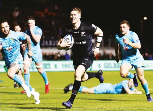  ?? PICTURES: Getty Images ?? Making the game safe: David Strettle scores the third try for Saracens