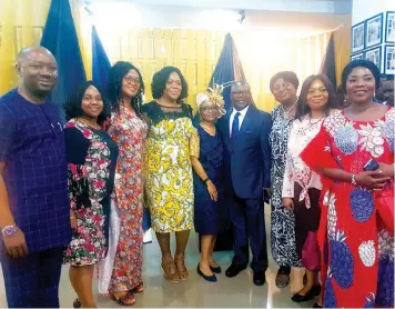  ??  ?? Tayo Oyetibo (SAN) and wife Abiola Oyetibo in the middle surrounded by workers of the Law of Tayo Oyetibo LP during the firm’s thanksgivi­ng service in Lagos