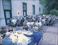  ?? Quantum Theatre ?? The audience enjoys dinner during intermissi­on at Quantum Theatre's 2014 production of "Tamara."