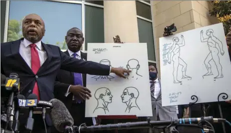  ?? TRAVIS LONG/THE NEWS & OBSERVER VIA AP ?? Attorneys for the family of Andrew Brown Jr., Wayne Kendall (left) and Ben Crump hold a news conference on Tuesday outside the Pasquotank County Public safety building in Elizabeth City, N.C., to announce results of the autopsy they commission­ed.