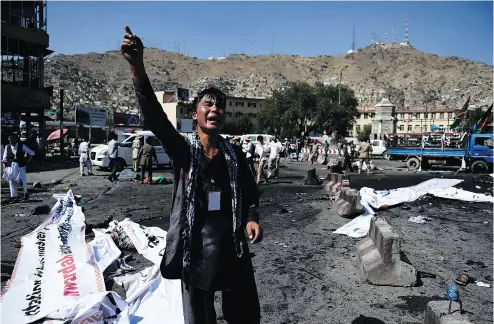  ?? WAKIL KOHSAR / AFP / GETTY IMAGES FILES ?? A protester screams near the scene of a suicide attack that targeted crowds of minority Shiite Hazaras in 2016. Hazaras have long been subjected to periodic outbreaks of genocidal violence in the country, Terry Glavin writes.